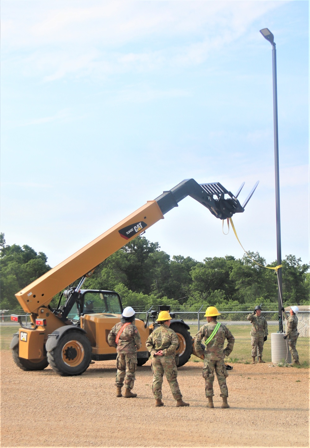 389th Engineer Company supports troop project to install light poles in Fort McCoy’s CRSP yard