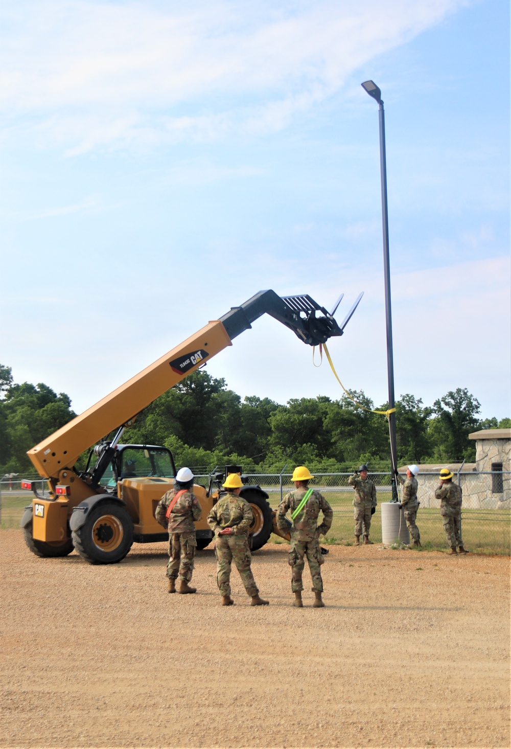 389th Engineer Company supports troop project to install light poles in Fort McCoy’s CRSP yard