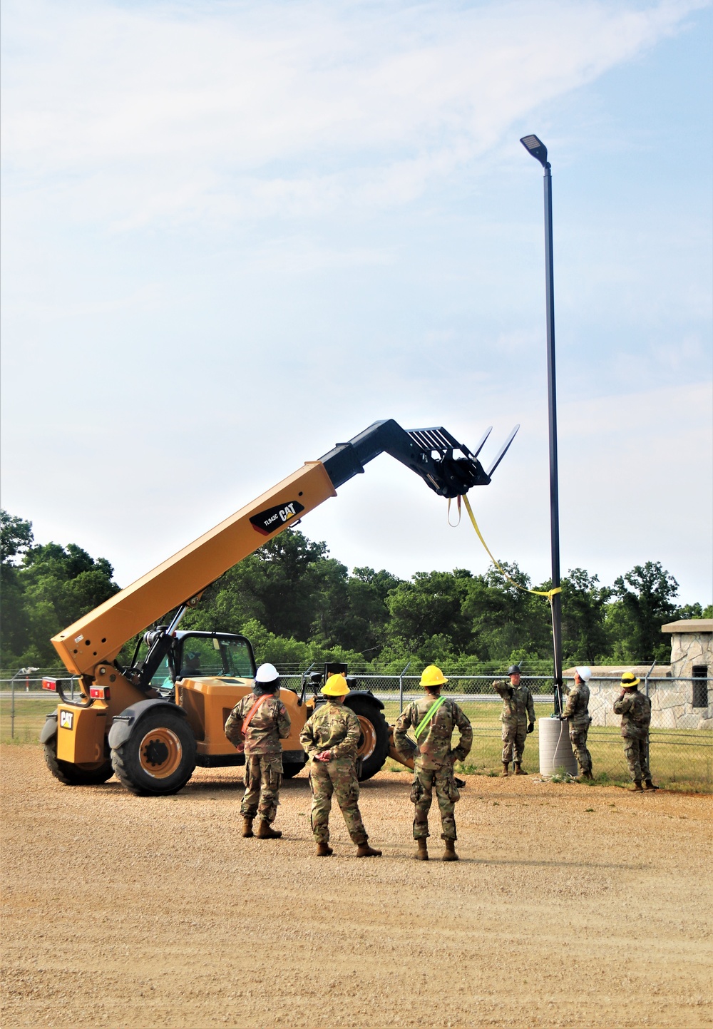 389th Engineer Company supports troop project to install light poles in Fort McCoy’s CRSP yard