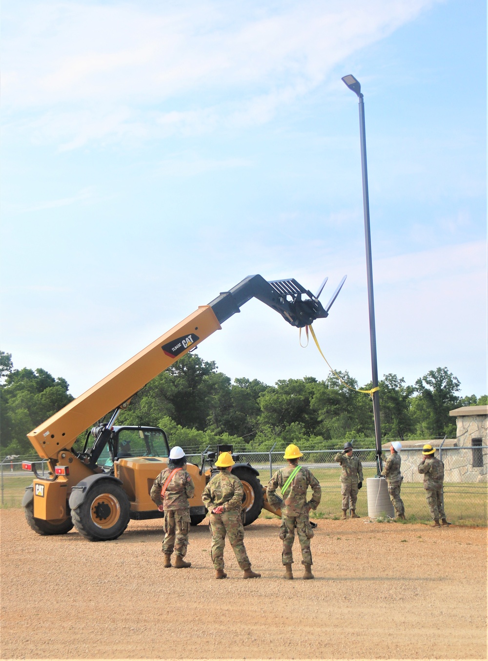 389th Engineer Company supports troop project to install light poles in Fort McCoy’s CRSP yard