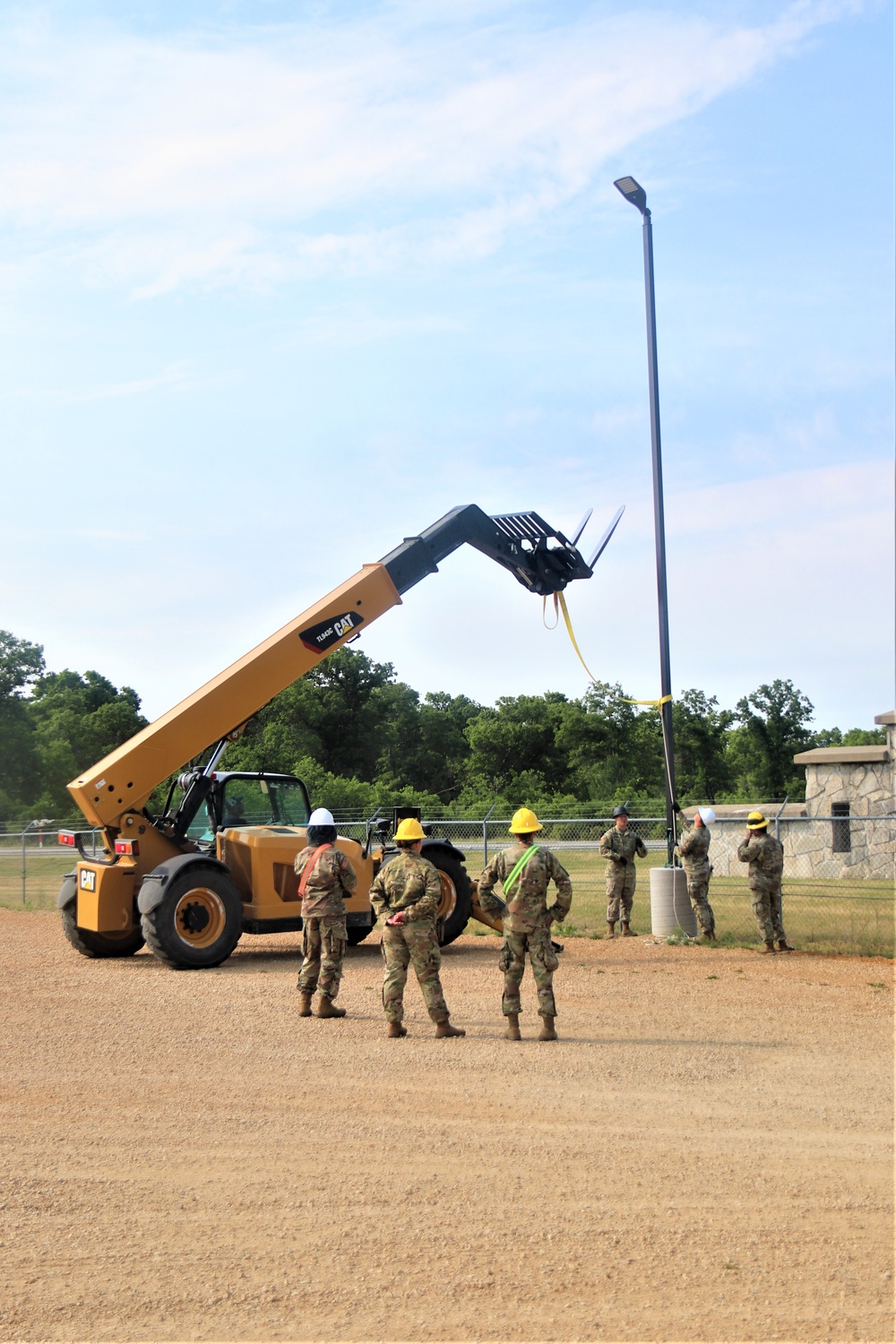 389th Engineer Company supports troop project to install light poles in Fort McCoy’s CRSP yard