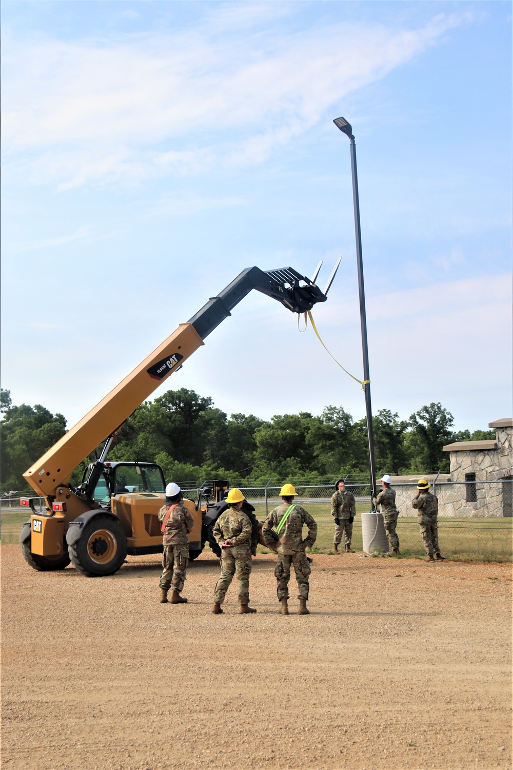 389th Engineer Company supports troop project to install light poles in Fort McCoy’s CRSP yard