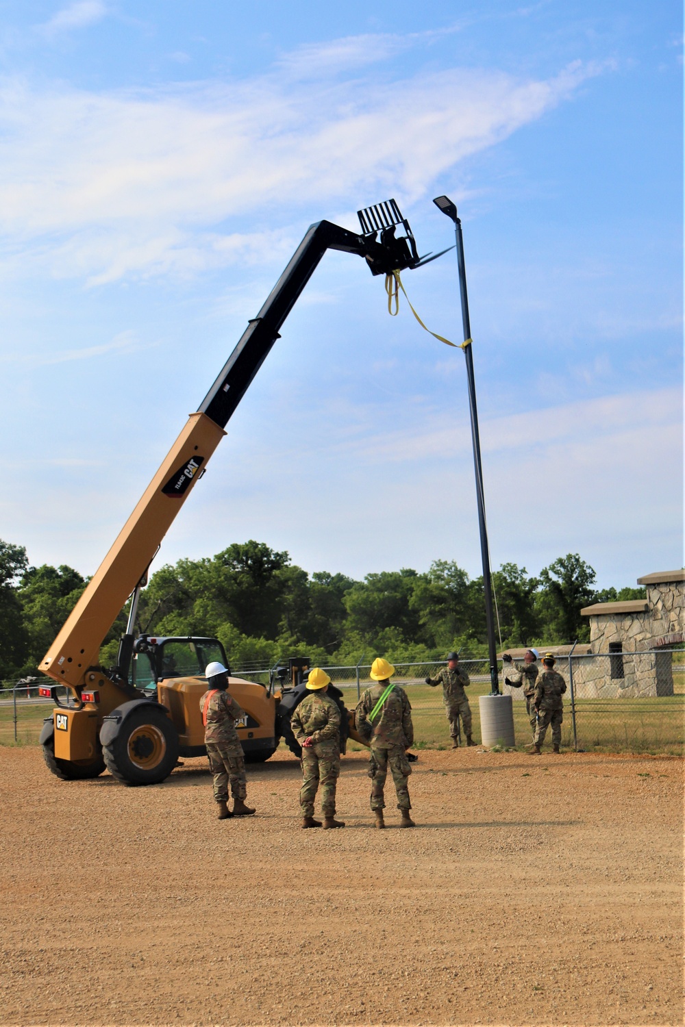 389th Engineer Company supports troop project to install light poles in Fort McCoy’s CRSP yard