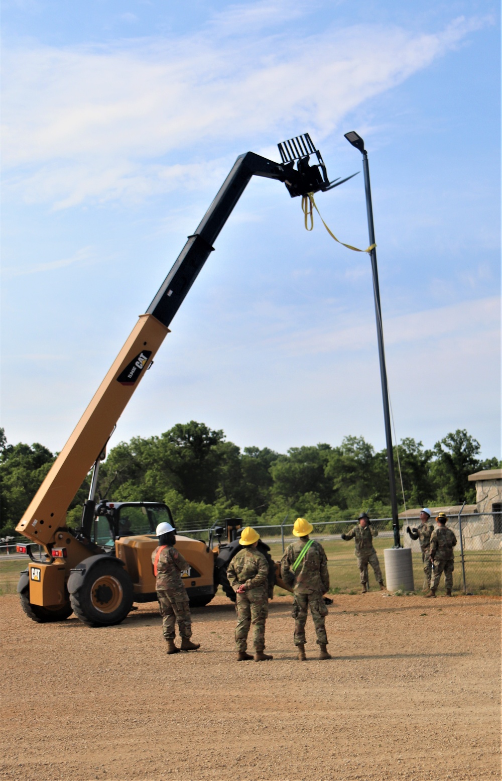 389th Engineer Company supports troop project to install light poles in Fort McCoy’s CRSP yard