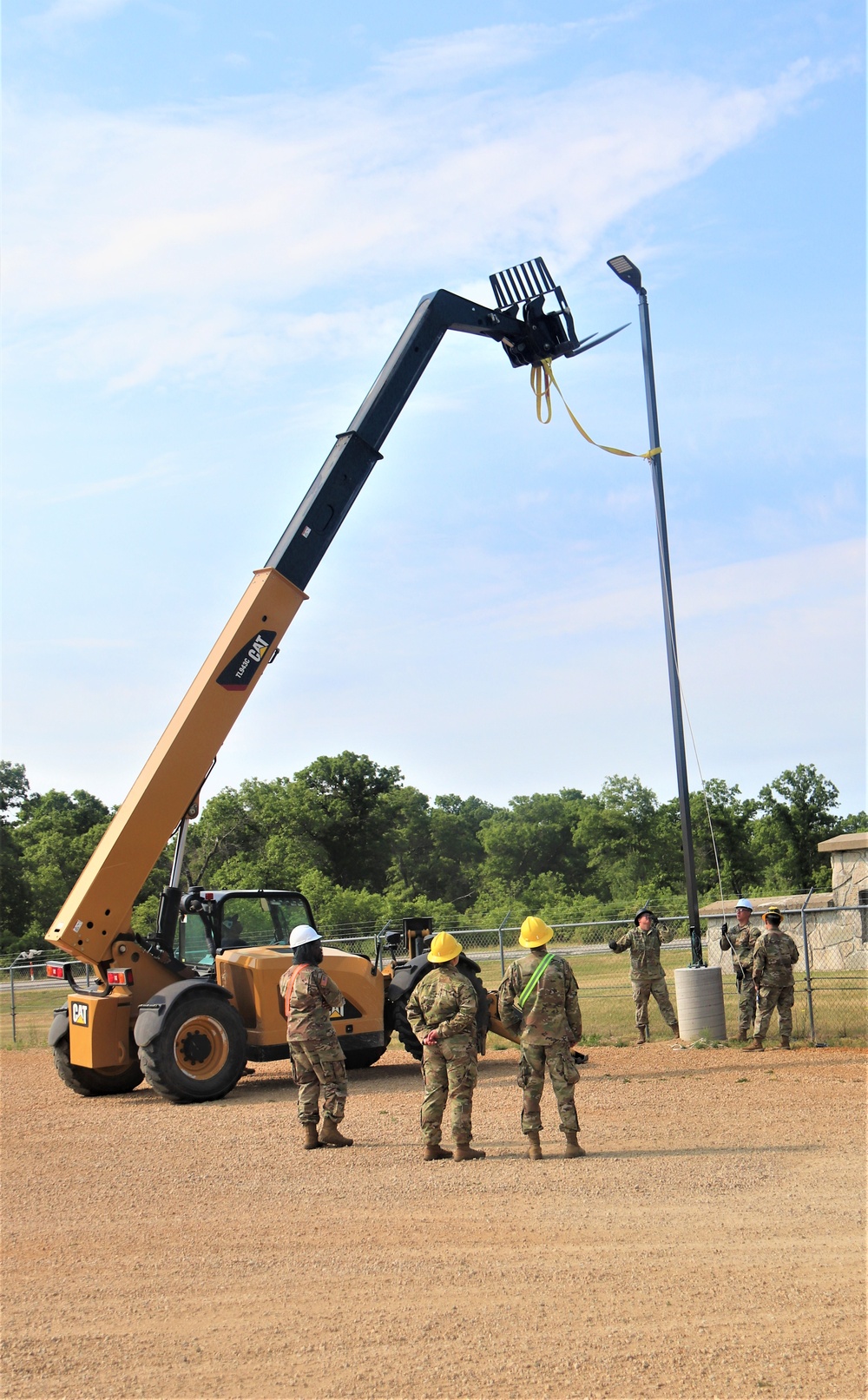 389th Engineer Company supports troop project to install light poles in Fort McCoy’s CRSP yard