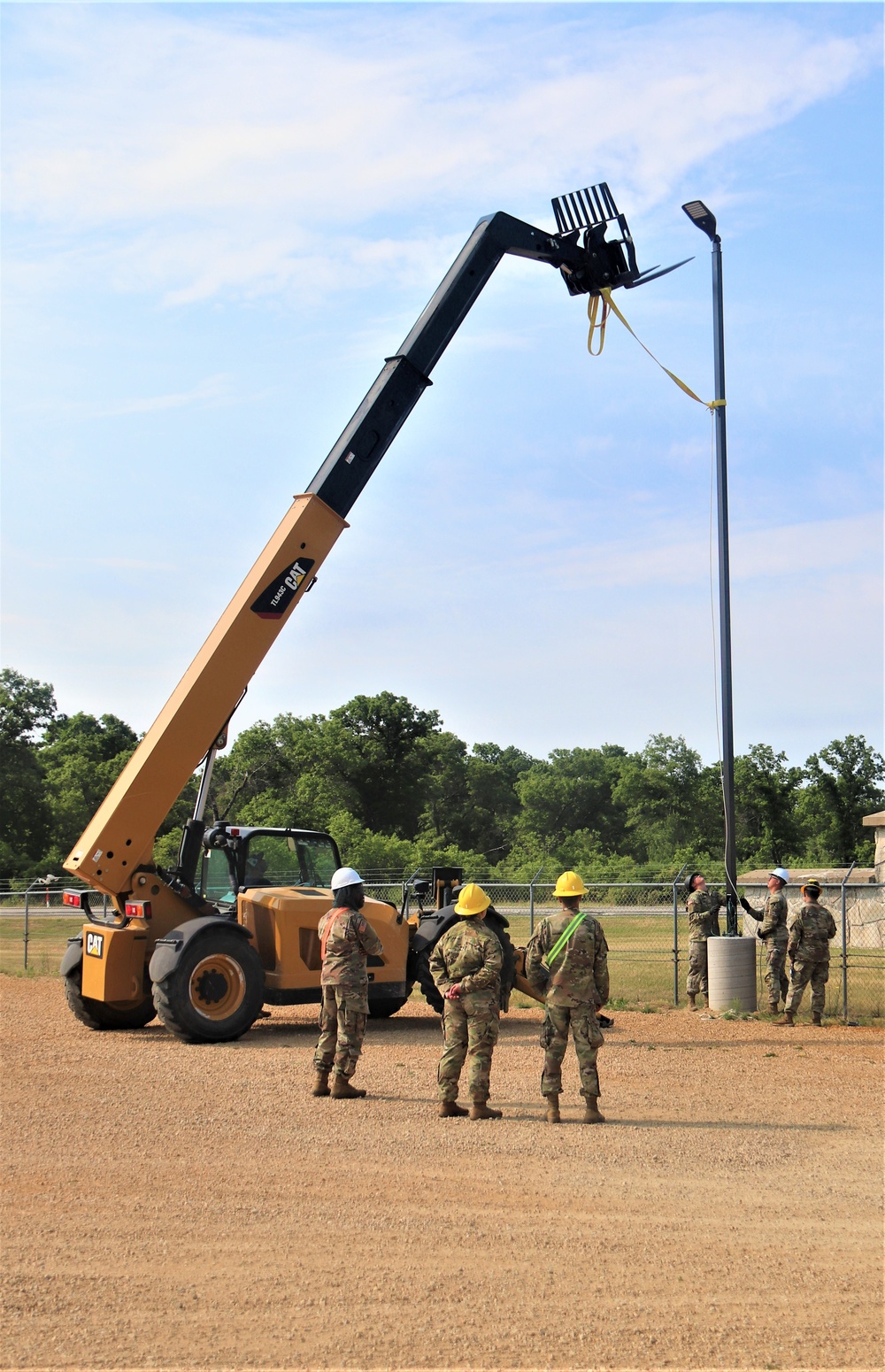 389th Engineer Company supports troop project to install light poles in Fort McCoy’s CRSP yard