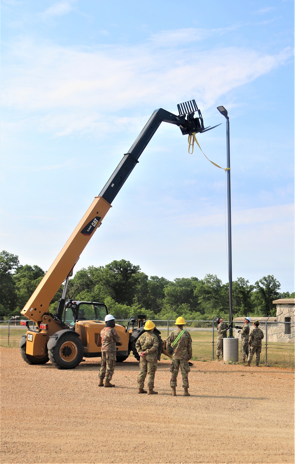 389th Engineer Company supports troop project to install light poles in Fort McCoy’s CRSP yard