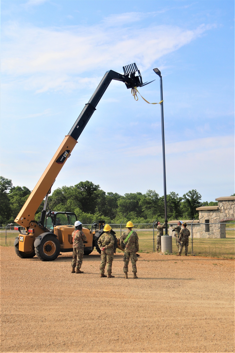 389th Engineer Company supports troop project to install light poles in Fort McCoy’s CRSP yard