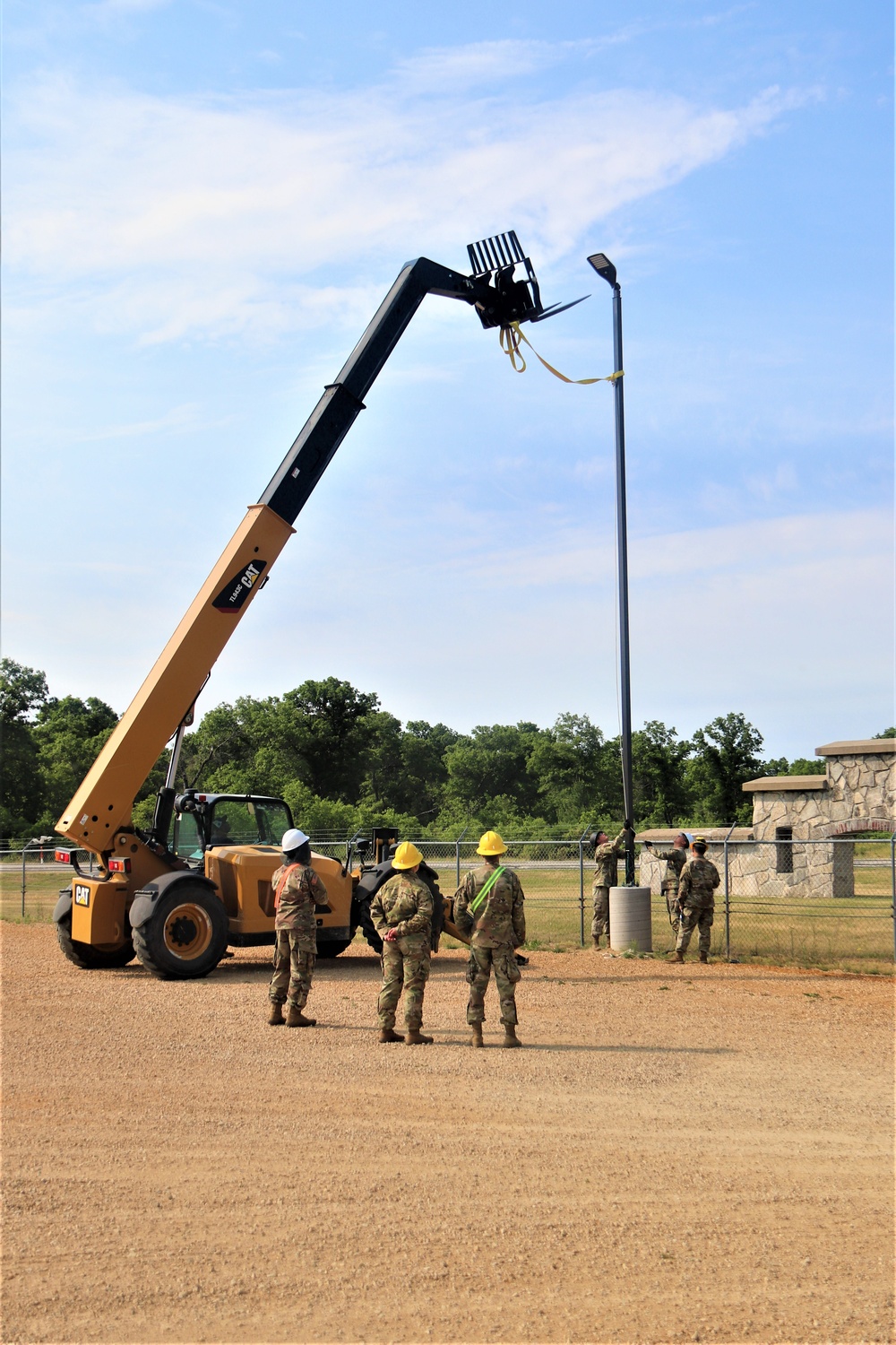 389th Engineer Company supports troop project to install light poles in Fort McCoy’s CRSP yard