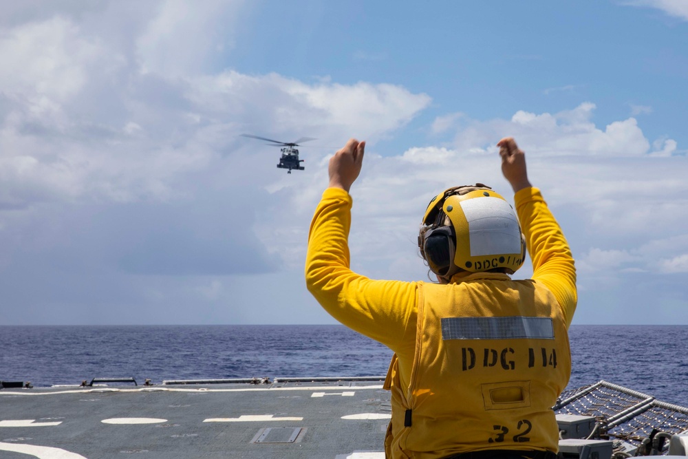 Sailors conduct flight quarters aboard USS Ralph Johnson (DDG 114), 29 June.