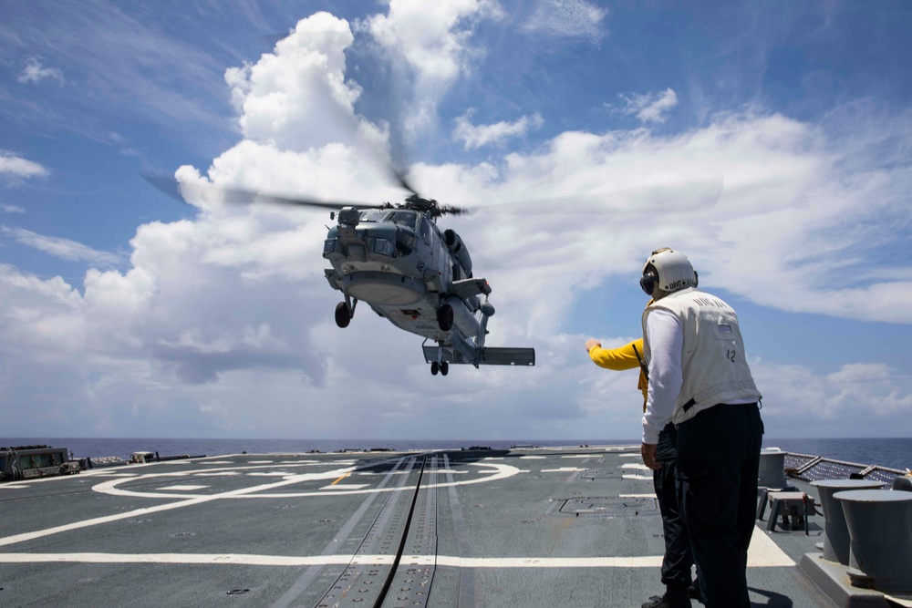 Sailors conduct flight quarters aboard USS Ralph Johnson (DDG 114), 29 June.