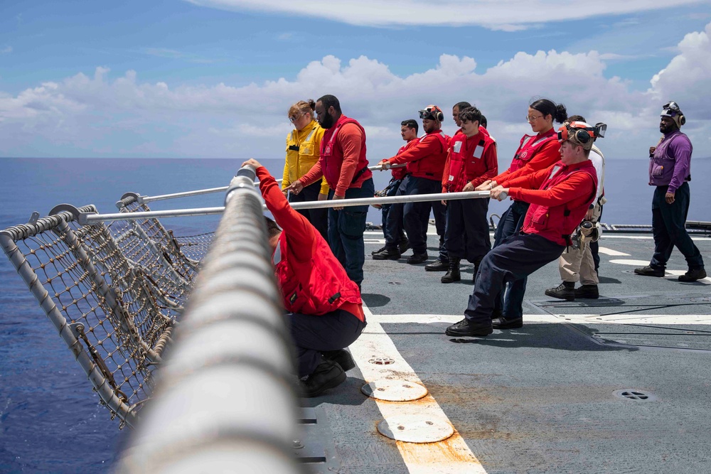 Sailors conduct flight quarters aboard USS Ralph Johnson (DDG 114), 29 June.