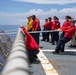 Sailors conduct flight quarters aboard USS Ralph Johnson (DDG 114), 29 June.