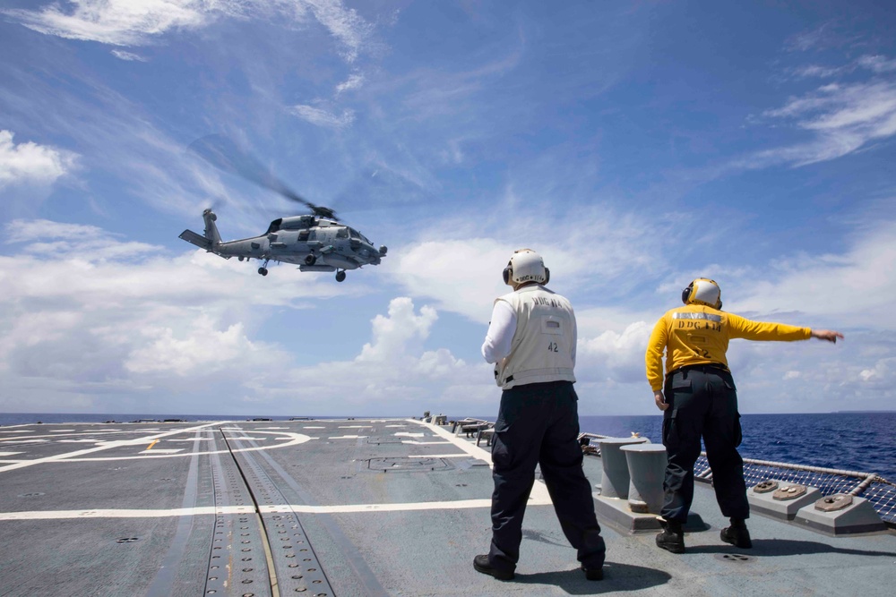 Sailors conduct flight quarters aboard USS Ralph Johnson (DDG 114), 29 June.