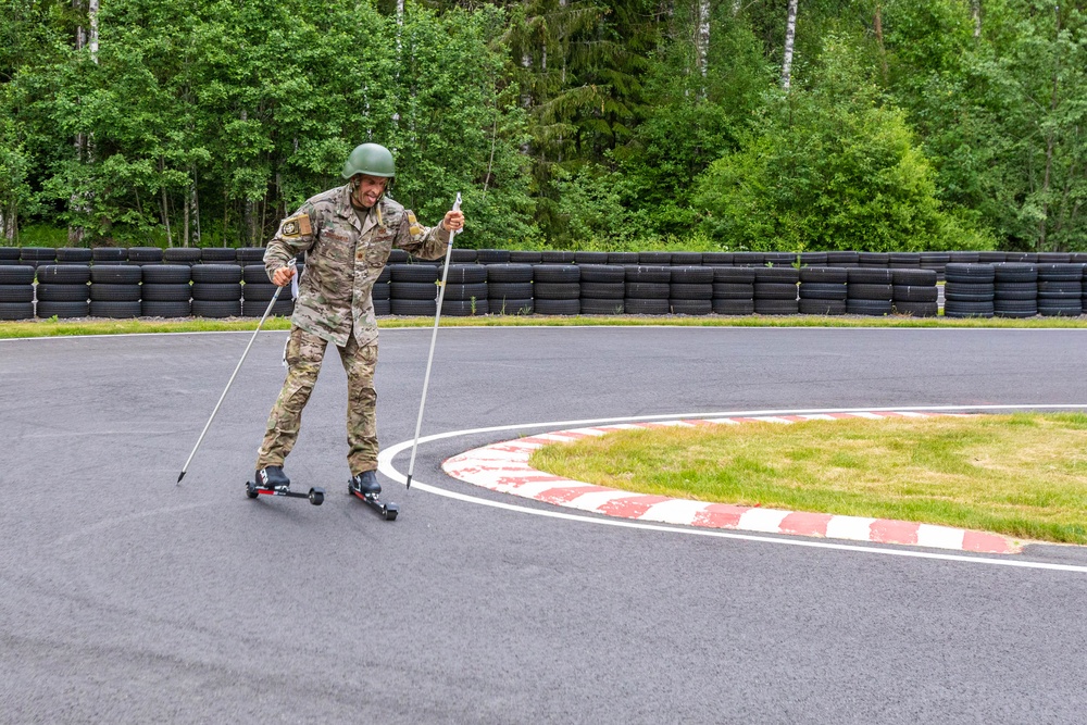 U.S. Air Force Reserve Maj. Sterling Broadhead simulates cross country skiing on roller skis