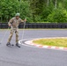 U.S. Air Force Reserve Maj. Sterling Broadhead simulates cross country skiing on roller skis