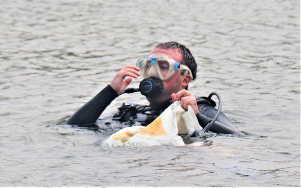 Fort McCoy biologists go diving to curb invasive plant species