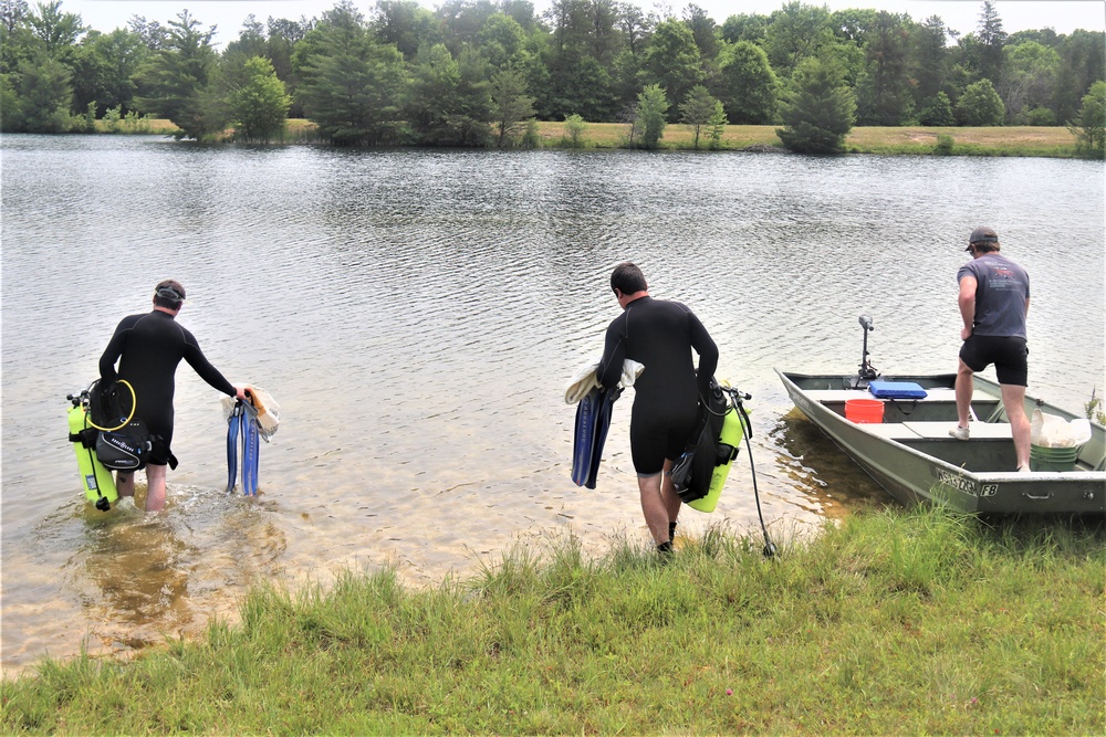 Fort McCoy biologists go diving to curb invasive plant species