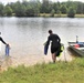 Fort McCoy biologists go diving to curb invasive plant species