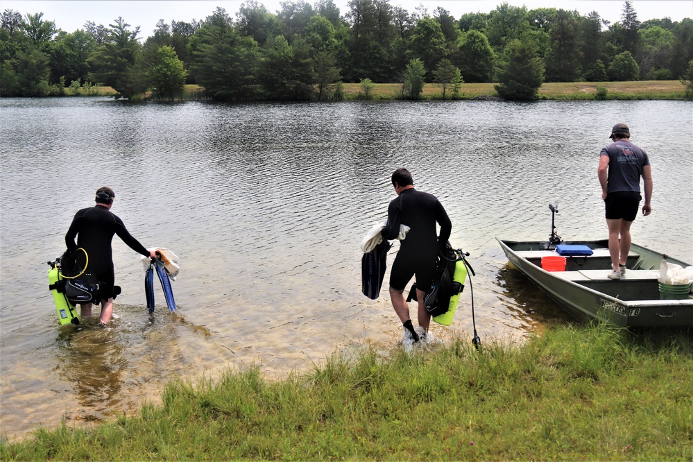Fort McCoy biologists go diving to curb invasive plant species