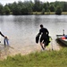 Fort McCoy biologists go diving to curb invasive plant species