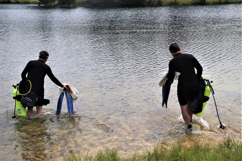 Fort McCoy biologists go diving to curb invasive plant species