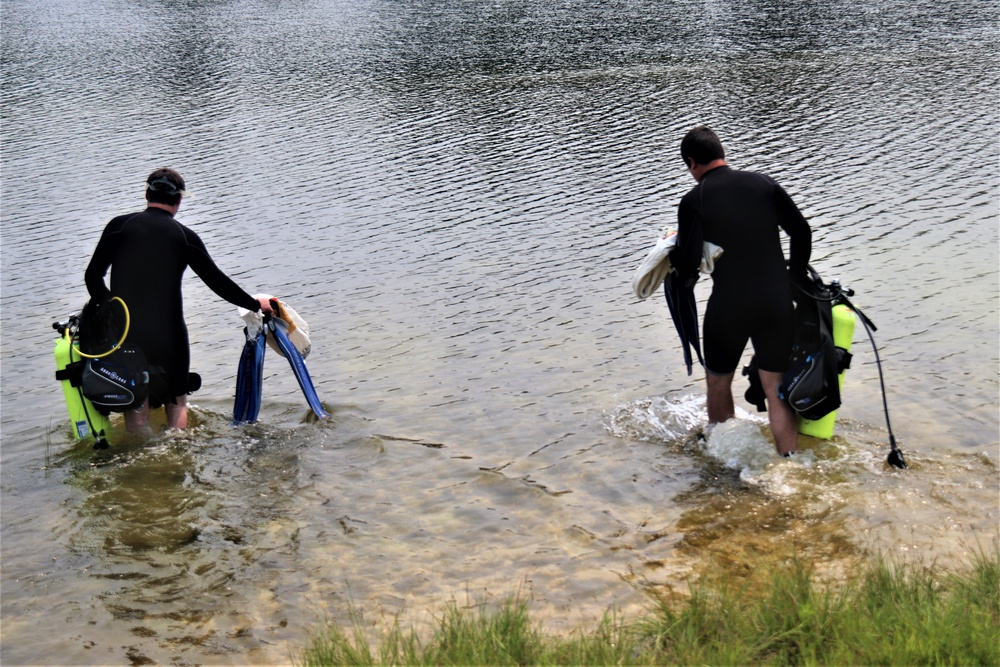 Fort McCoy biologists go diving to curb invasive plant species