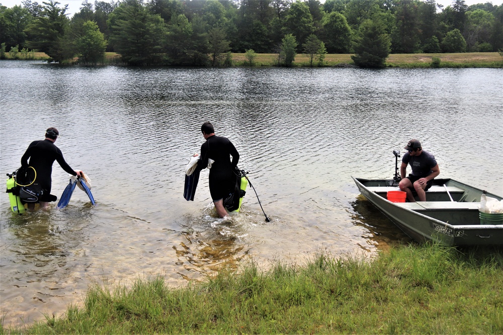 Fort McCoy biologists go diving to curb invasive plant species