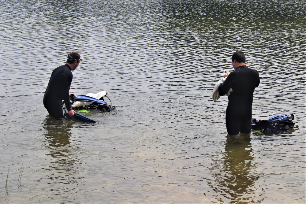 Fort McCoy biologists go diving to curb invasive plant species