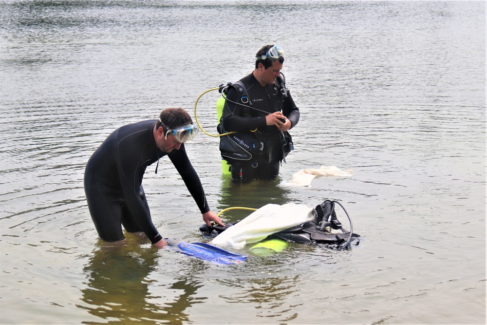 Fort McCoy biologists go diving to curb invasive plant species
