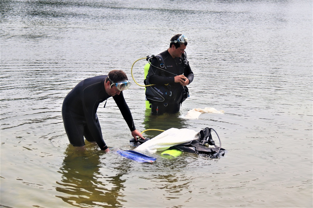Fort McCoy biologists go diving to curb invasive plant species