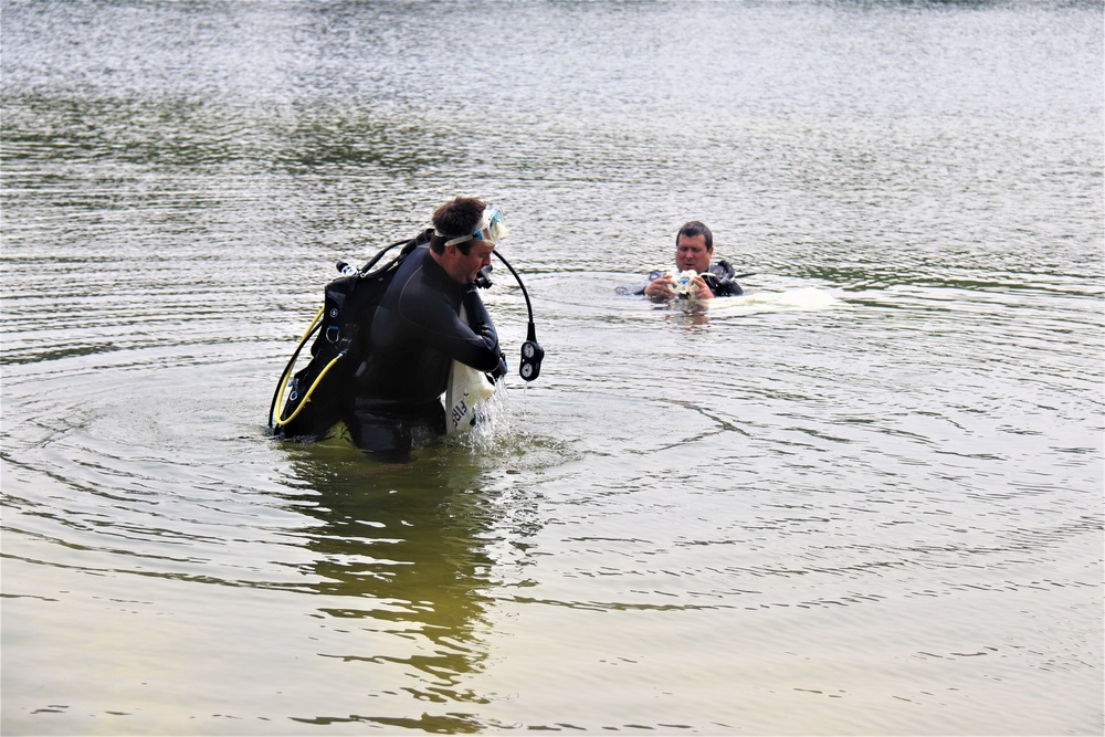 Fort McCoy biologists go diving to curb invasive plant species