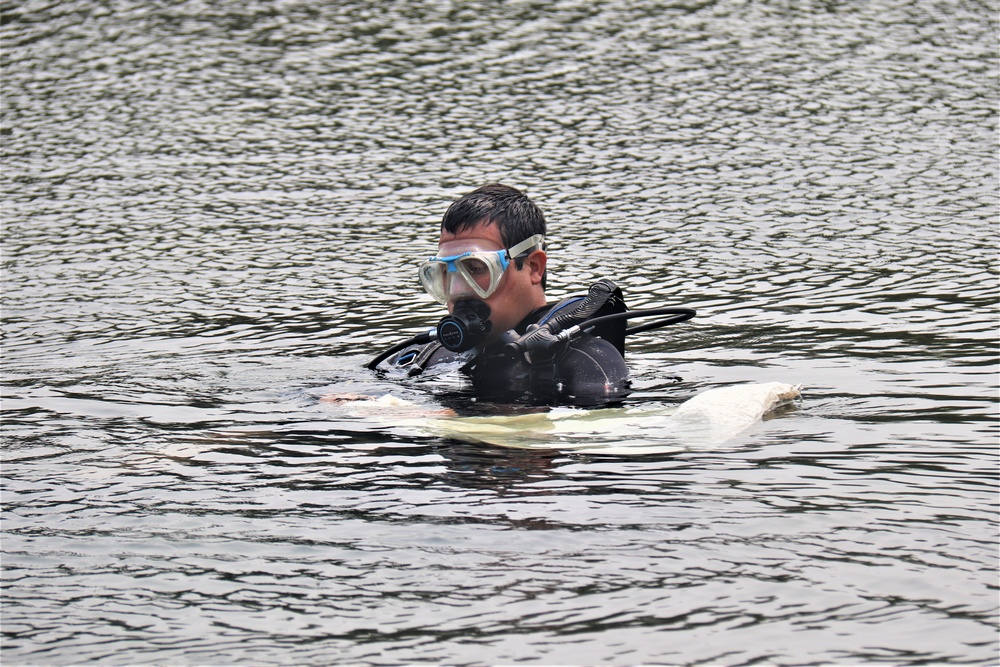 Fort McCoy biologists go diving to curb invasive plant species