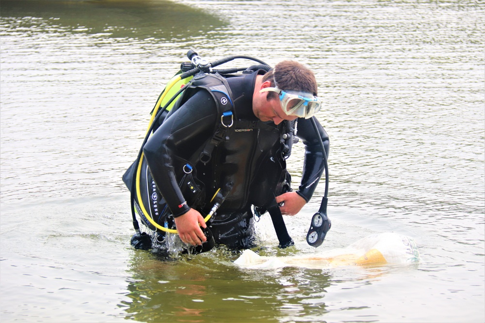 Fort McCoy biologists go diving to curb invasive plant species