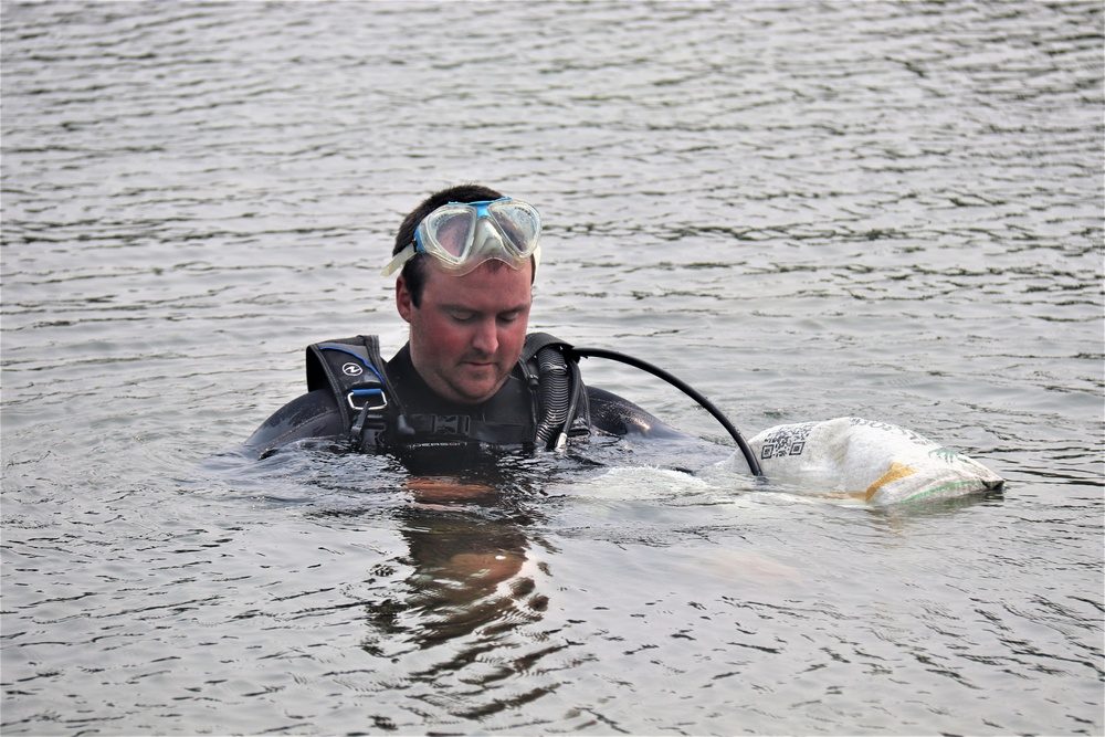 Fort McCoy biologists go diving to curb invasive plant species