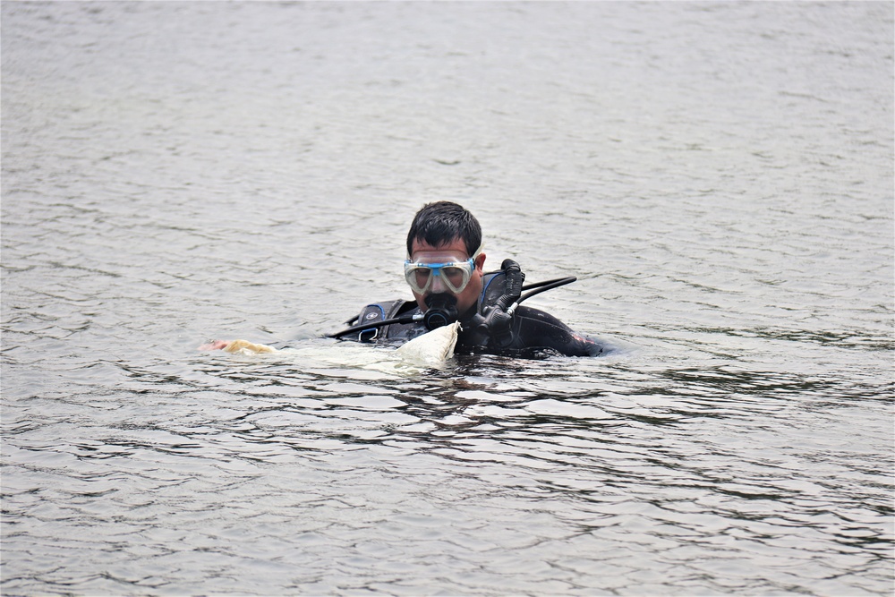 Fort McCoy biologists go diving to curb invasive plant species