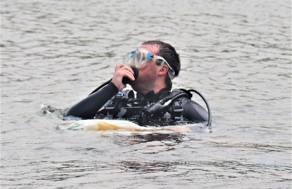 Fort McCoy biologists go diving to curb invasive plant species