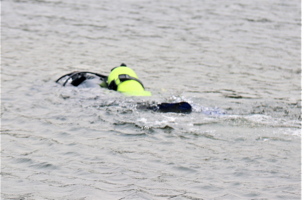 Fort McCoy biologists go diving to curb invasive plant species