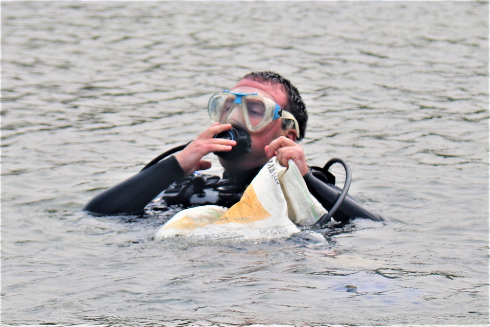 Fort McCoy biologists go diving to curb invasive plant species