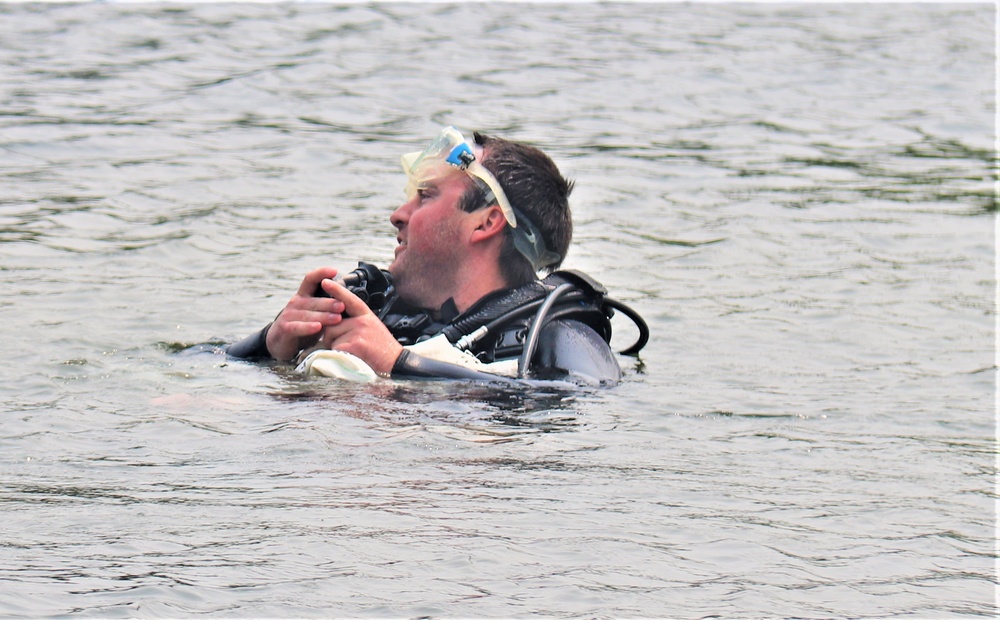 Fort McCoy biologists go diving to curb invasive plant species