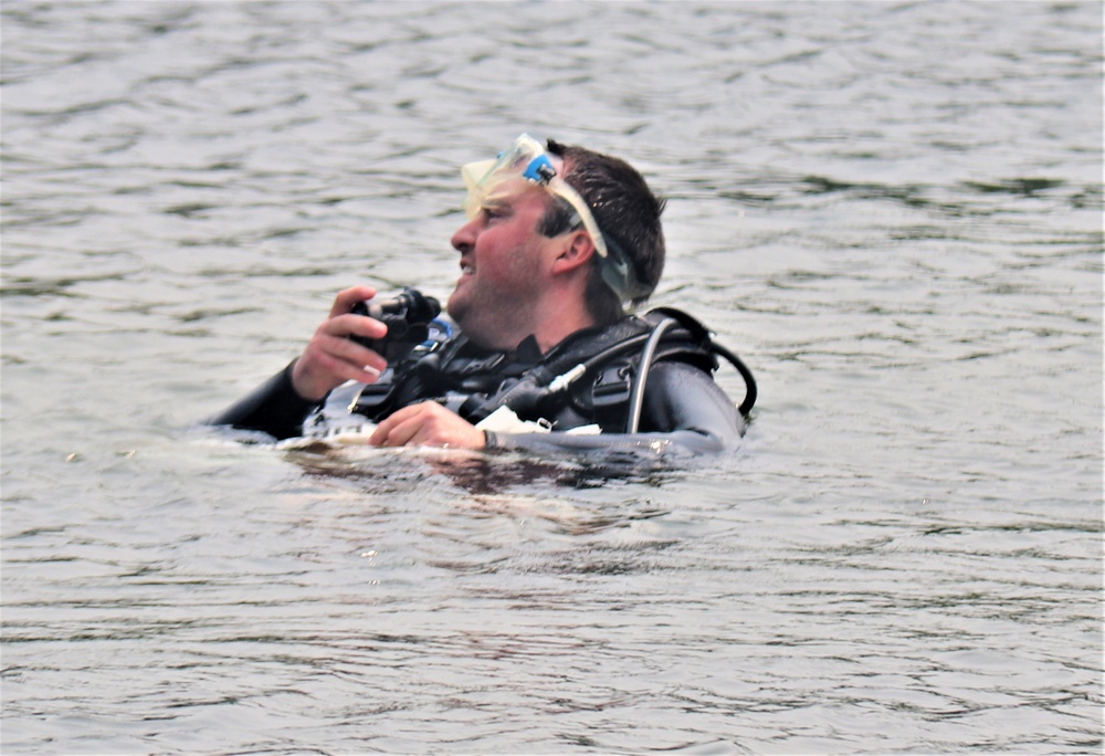 Fort McCoy biologists go diving to curb invasive plant species