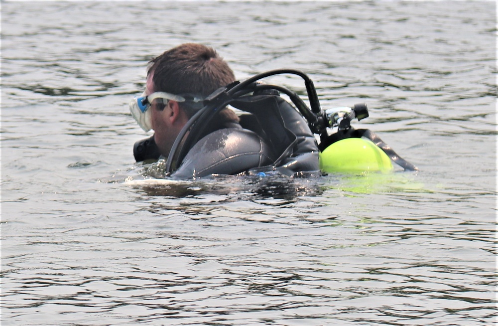 Fort McCoy biologists go diving to curb invasive plant species