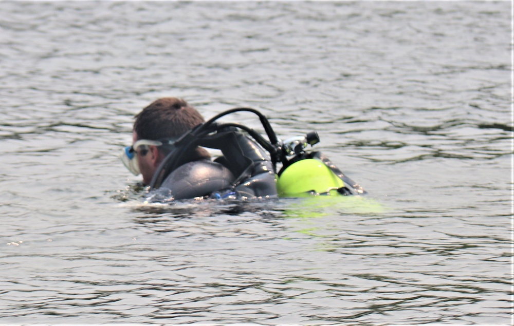 Fort McCoy biologists go diving to curb invasive plant species