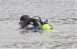 Fort McCoy biologists go diving to curb invasive plant species
