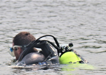 Fort McCoy biologists go diving to curb invasive plant species