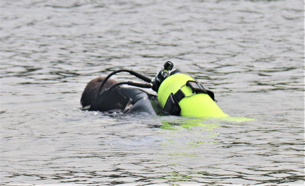 Fort McCoy biologists go diving to curb invasive plant species