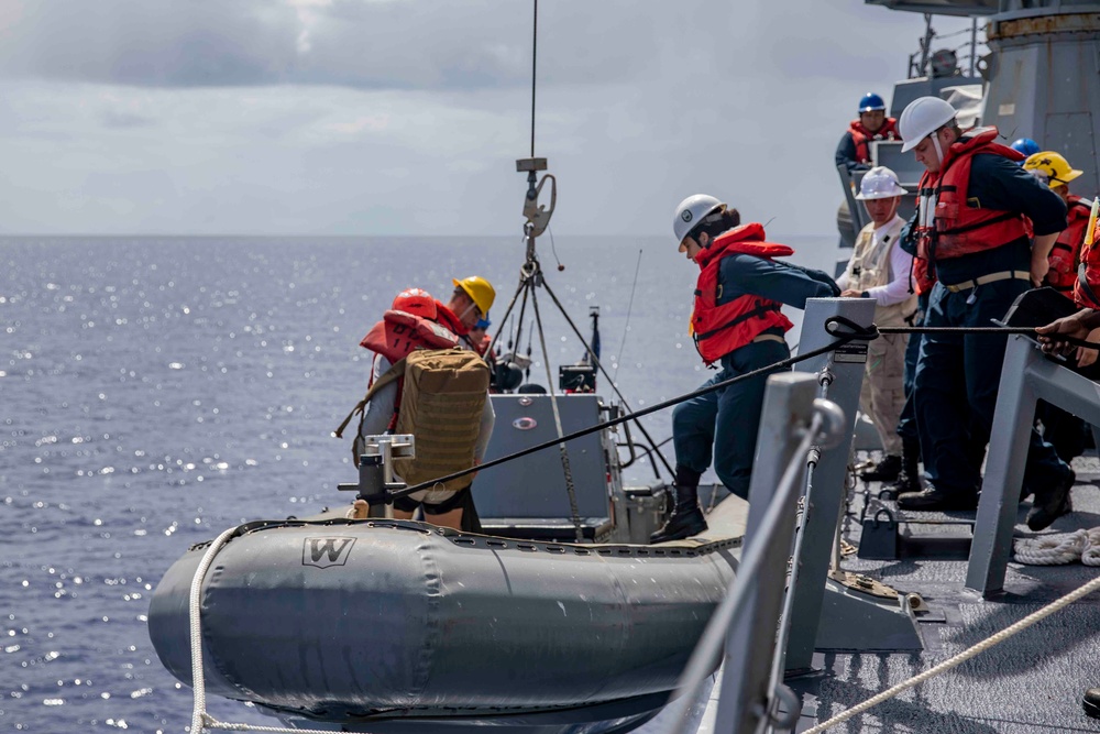 Sailors conduct small boat operations aboard USS Ralph Johnson (DDG 114), 29 June.