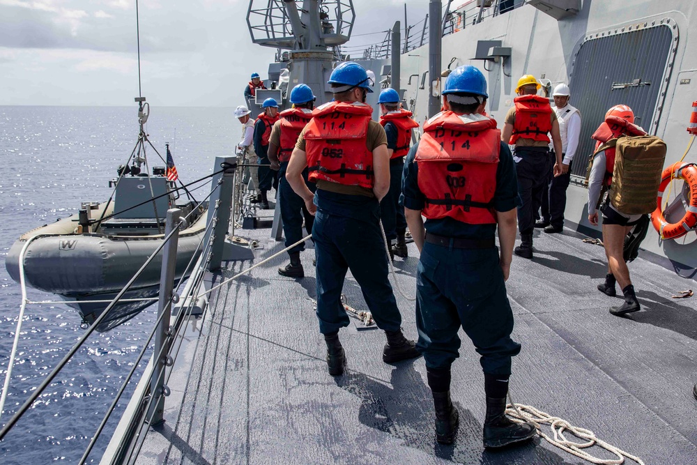 Sailors conduct small boat operations aboard USS Ralph Johnson (DDG 114), 29 June.