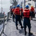 Sailors conduct small boat operations aboard USS Ralph Johnson (DDG 114), 29 June.