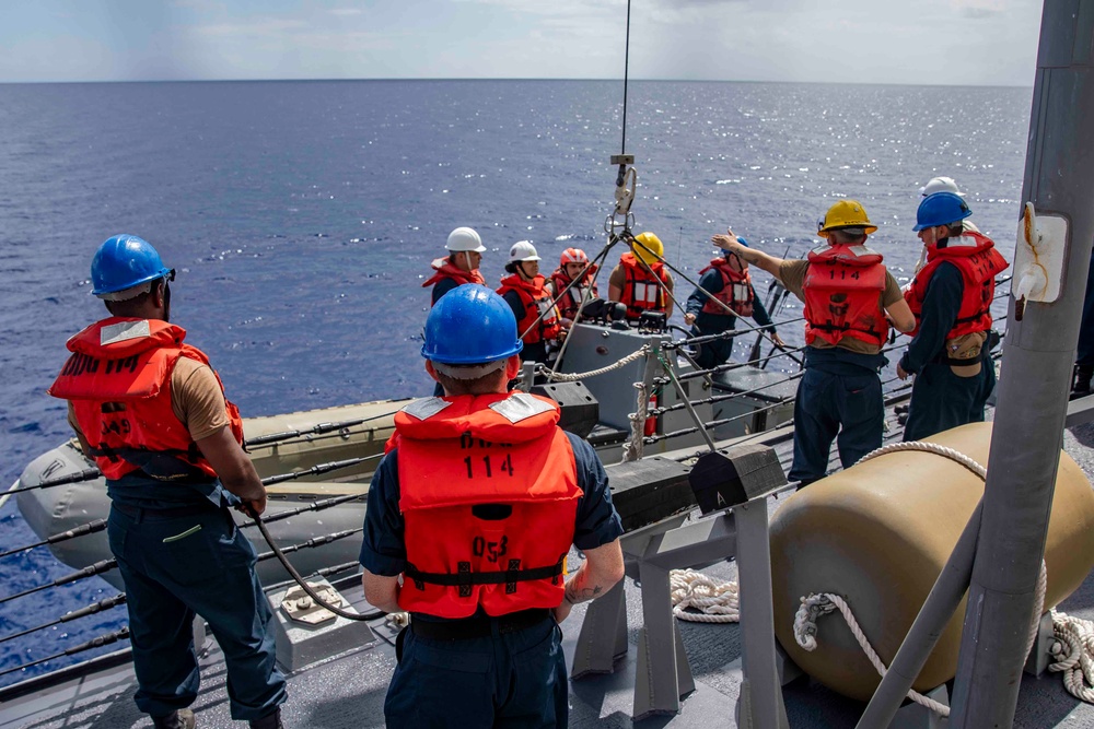 Sailors conduct small boat operations aboard USS Ralph Johnson (DDG 114), 29 June.